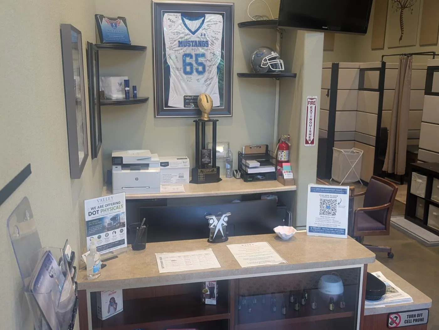 Reception counter at the Mountain House office with DOT physical information and local high school sports memorabilia