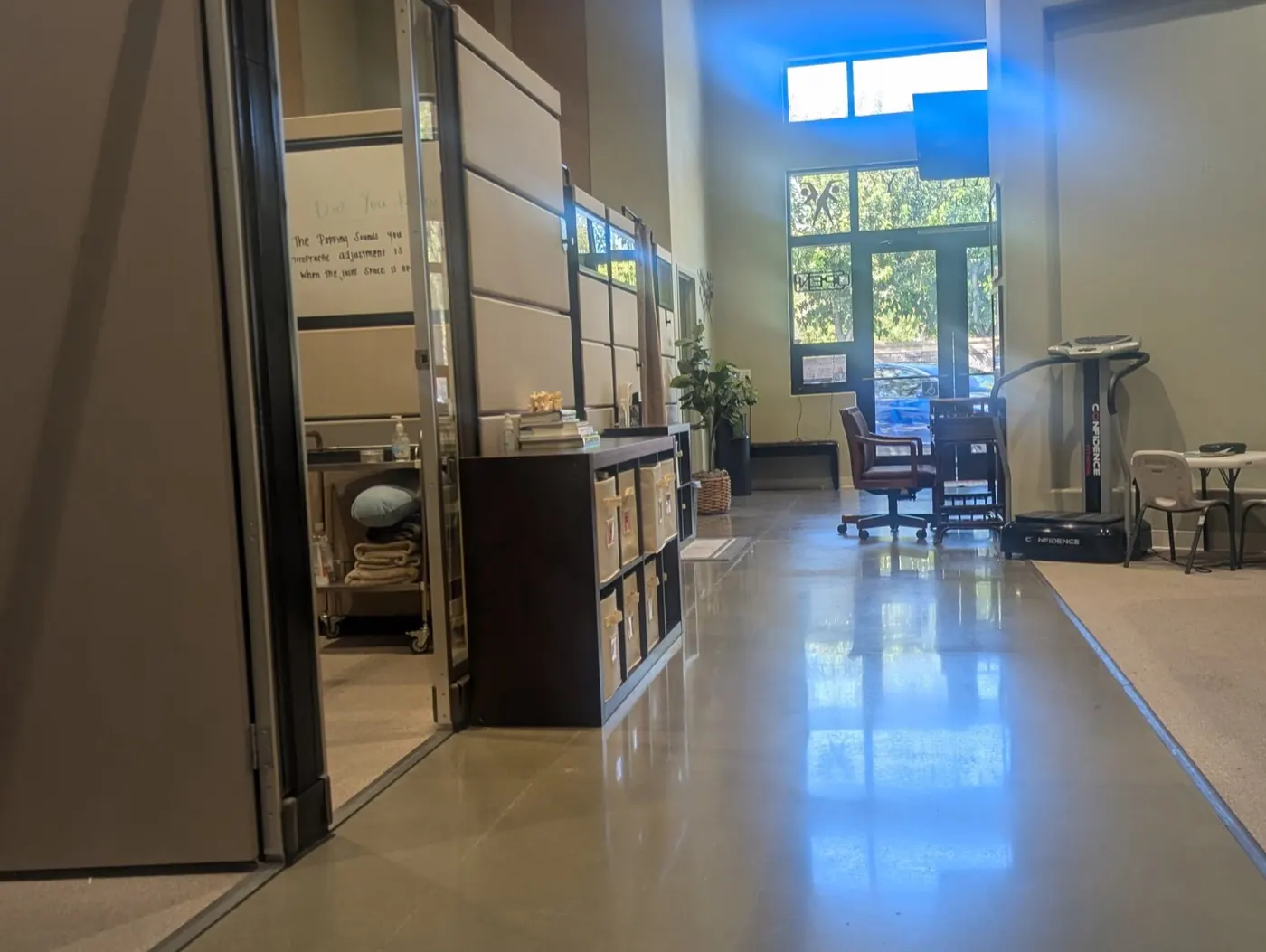 Hallway at the Mountain House office looking toward the front entrance, with treatment bays along one side