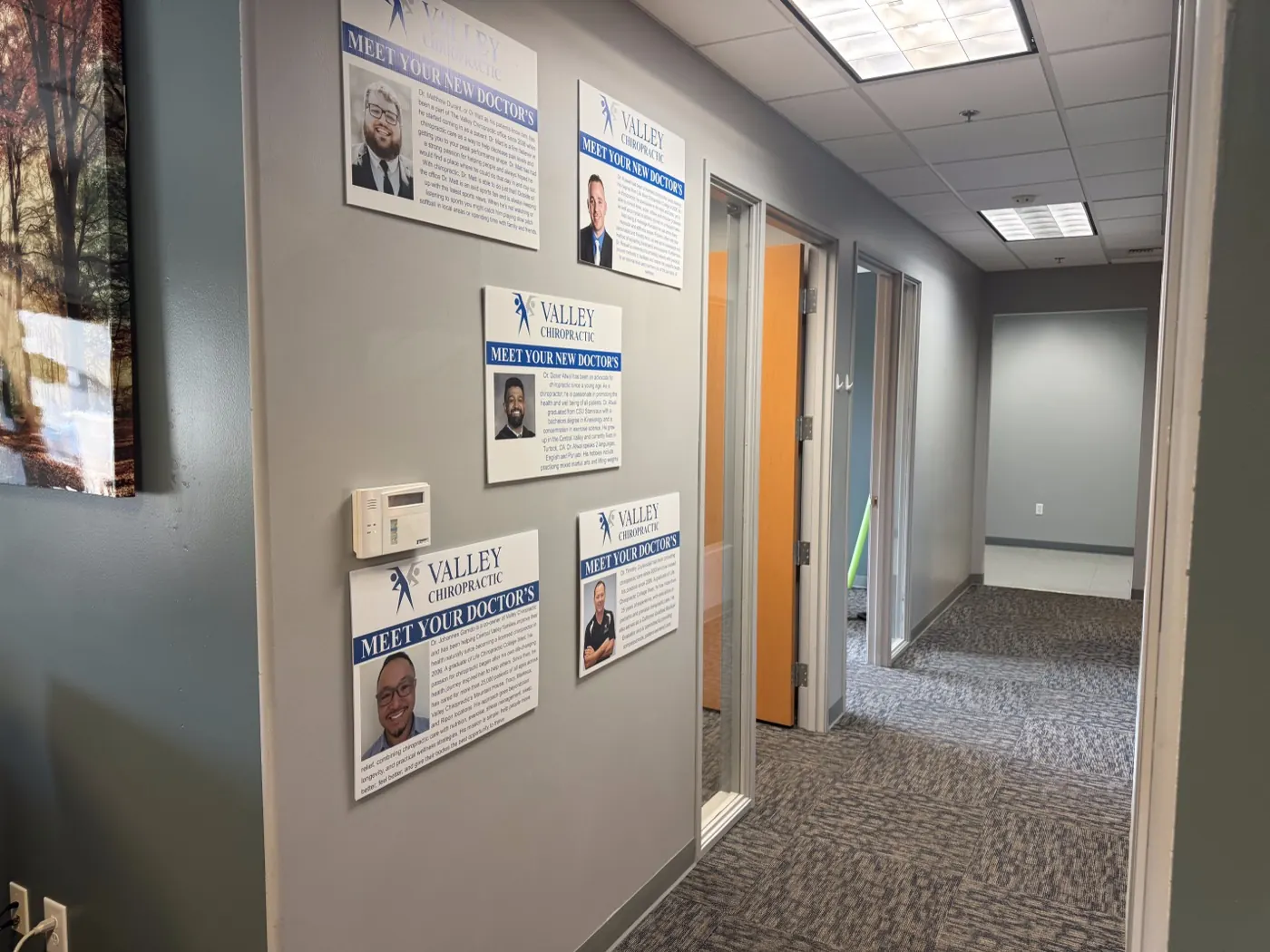 Hallway at the Ripon office lined with Meet Your Doctor profiles for the Valley Chiropractic team